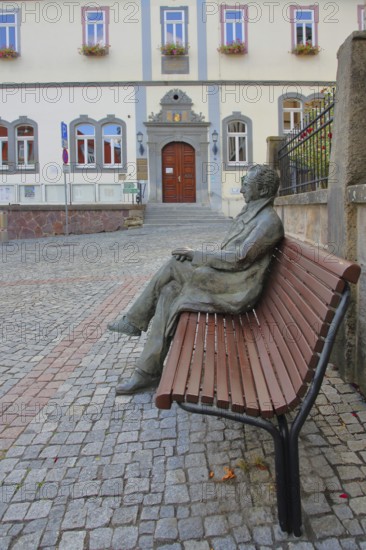 Johann Wolfgang von Goethe by Klaus Gutting sitting on the bench, arms, bronze sculpture, looking,