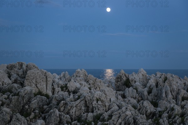 Rocks by the sea and full moon, Cap Martin, near Menton, Alpes Maritimes, Provence Alpes Cote