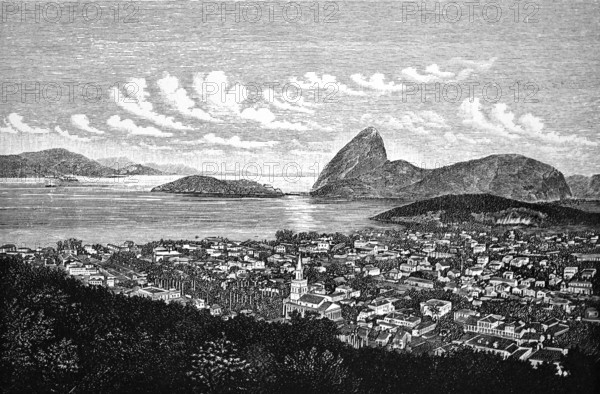 Cityscape of Rio de Janeiro, church, houses, green areas, Guanabara Bay, water and mountain