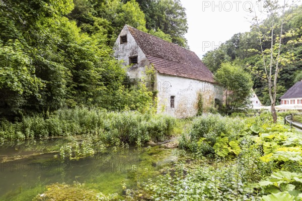 Old barn. The building is located near the source of the Zwiefalter Ach river at the Wimsen Cave