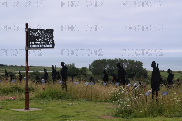 Installation, Juno Beach sign, Standing with Giants, honours the victims of the fallen British