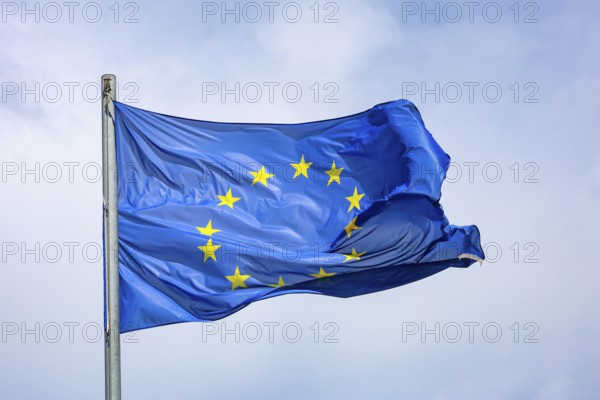 Düsseldorf, North Rhine-Westphalia, Germany - European flag fluttering in the wind on the flagpole,