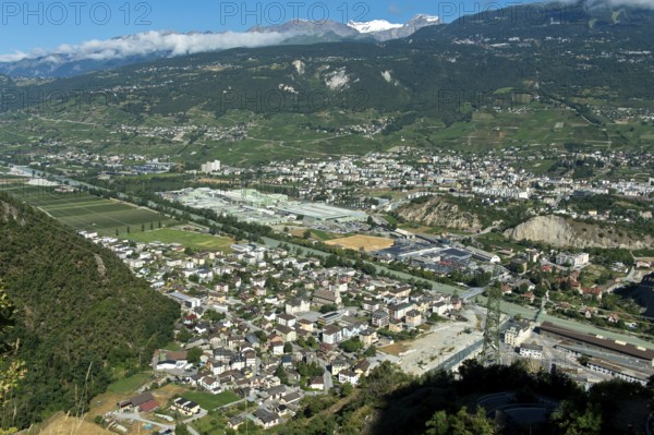 The towns of Chippis, foreground, and Sierre, background, in the Rhone Valley, the production
