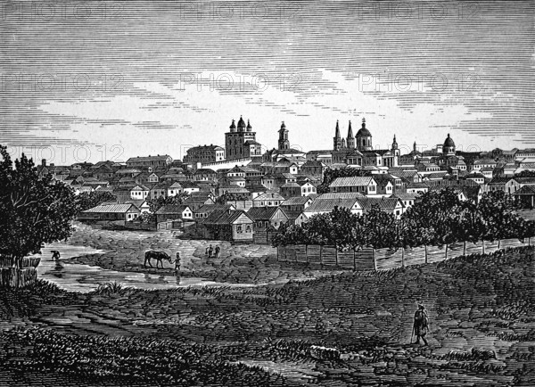 View over the meadows and the Volga towards Astrakhan, city on a hill with numerous churches and