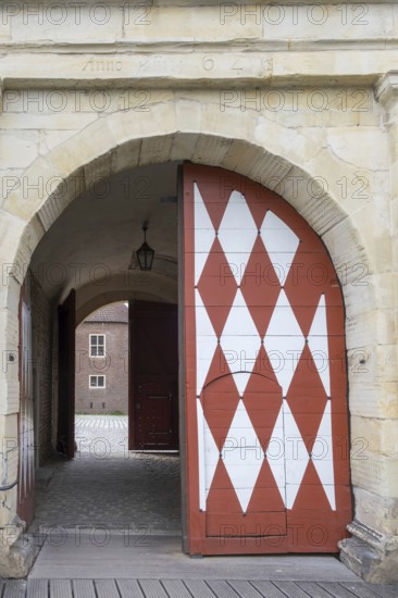 Historic moated castle, Renaissance Raesfeld Castle, façade with one Tor tor and one door, Freiheit