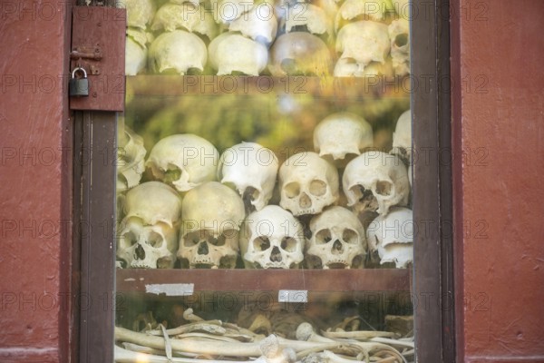 Shrine with human skull, memorial to the victims of the Khmer Rouge regime, Wat Thmei, Siem Reap,