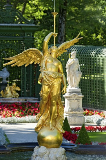 Fountain figure of the goddess Fama with fanfare in gold, Rococo style, west parterre, palace park