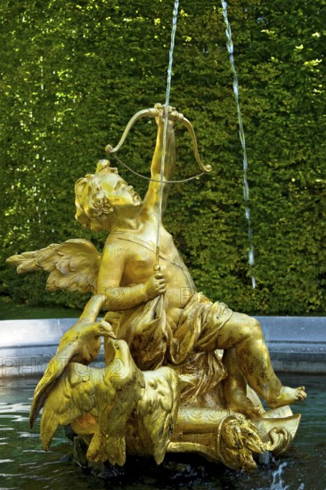 Fountain figure of Cupid, god of love, in gold with bow and arrow, Rococo style, east parterre,