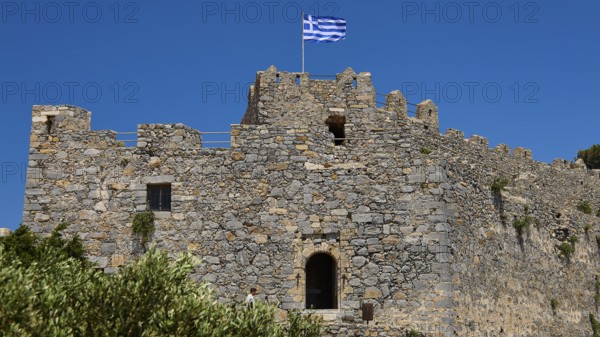Stone castle with Greek flag and window, Pandeli Castle, Castle, Leros Fortress, St John's