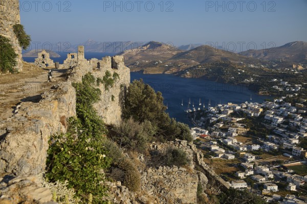 Picturesque ruins on a hill overlooking a coastal town and the sea, Pandeli Castle, Castle, Leros