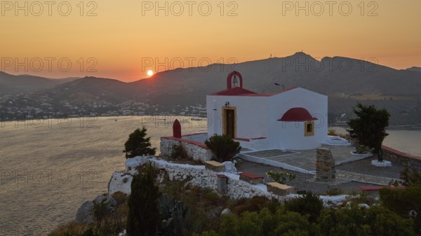 Chapel on a cliff at sunset with a view of the coast and mountains, Profitis Ilias Church, Prophet