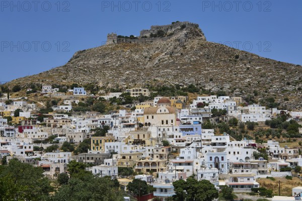 White village below a rocky castle on a hill, Pandeli Castle, castle, Leros Fortress, St John's