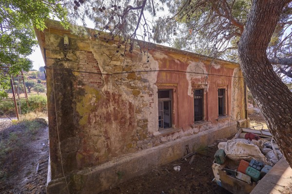 Lost Place, Old abandoned building with broken windows and surrounding nature, Radio Station, WW2,