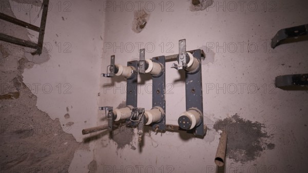 Lost Place, close-up of old electrical connections in a dilapidated building, Radio Station, WW2,