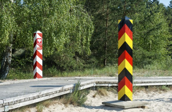 Pedestrian and cycle path with German and Polish border posts along the German-Polish border near