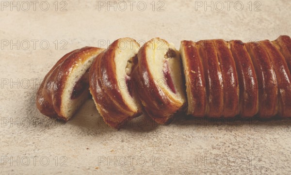 Sweet braided roll, stuffed with jam and raisins, pastries, sweet bread with filling, sweet pie, no