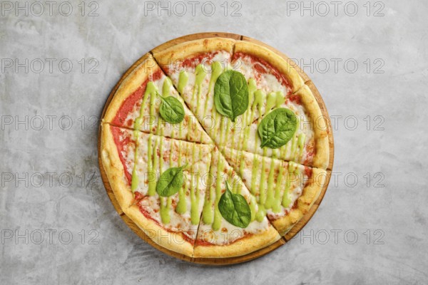 Mouthwatering pizza features a golden crust topped with rich tomato sauce, melted cheese, and fresh