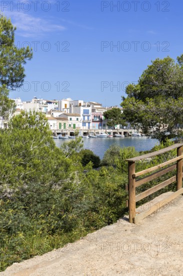 Portocolom fishing village on Majorca with boats and colourful houses Holiday by the sea in