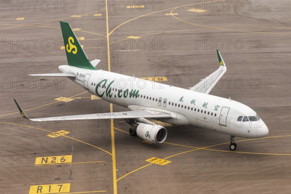 A Spring Airlines Airbus A320 aircraft with the registration B-300X at Chek Lap Kok Airport (HKG)