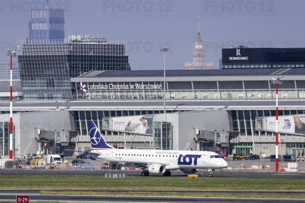 An Embraer 190 aircraft of LOT Polish Airlines with the registration number SP-LME at the airport