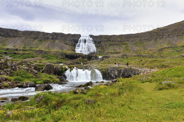 Dynjandi, Dynjandifoss or Fjallfoss, tourists, hikers at the waterfall in summer, river Dynjandisá,