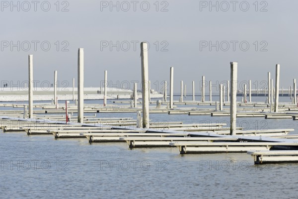 Winter day, onset of winter, snow on the jetties in the marina, North Sea, Norddeich, Lower Saxony,