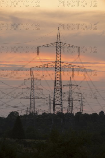 Sunset with numerous electricity pylons and a calm, dramatic atmosphere, Waiblingen,