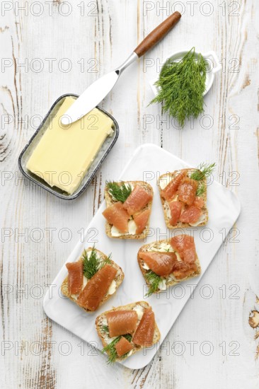 Delicious smoked herring caviar layered on cream cheese spread over crusty bread slices, topped