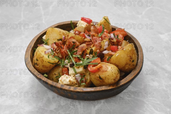 Perfectly cooked baby potatoes are seasoned with herbs and topped with crispy bacon, fresh