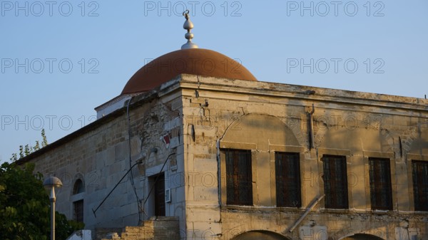 Defter-dar Mosque, Eleftherias Square, Historic building with red dome and old stone walls in the