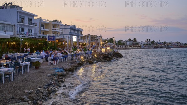 Restaurants at the Turkish ferry harbour, coastline with restaurants and relaxed atmosphere at