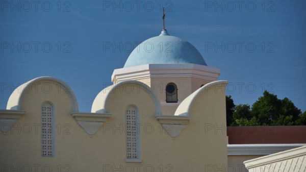 Church, Panagia Agia Paraskevi, detail of a blue dome on a light-coloured building under a blue
