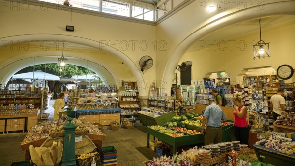 Agora, Municipal market hall, Inner market area with food shops and arches, lively with visitors,