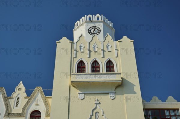 Palace of Justice, colonial building, close-up of a white clock tower with gothic arches against a