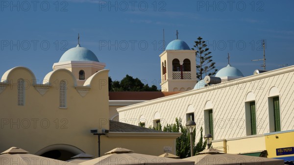Church, Panagia Agia Paraskevi, domed buildings under a blue sky with traditional architectural