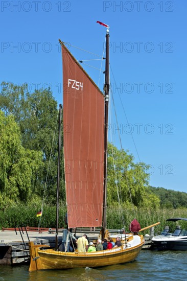 Zeesenboot casting off in Krummin natural harbour, Usedom Island, Mecklenburg-Western Pomerania,