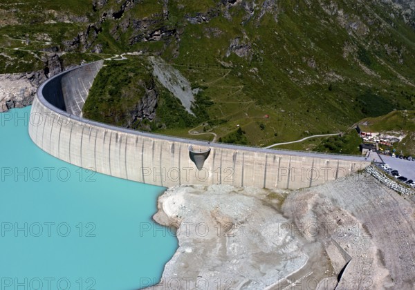 Impressive arch dam of the Moiry reservoir, Lac de Moiry, at low water in summer, Val d'Anniviers,