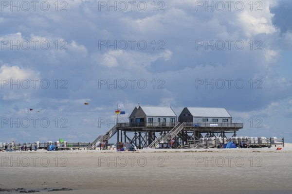 New pile dwellings on the beach with lifeguards and toilets, cloudy, Sankt Peter Ording,
