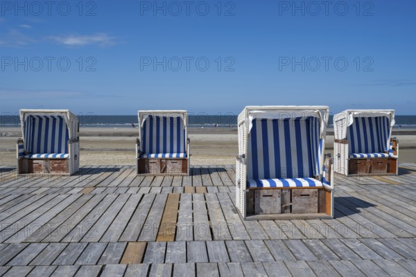 Beach chairs on wooden planks, Sankt Peter Ording, Eiderstedt, North Frisia, North Sea,