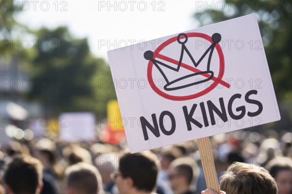Protest sign with text No kings and crossed-out crown. Demonstration in progress. Generative AI, AI