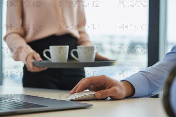 Woman's hand in pastel pink blouse holding a tray with white coffee mugs next to a man's hand on a