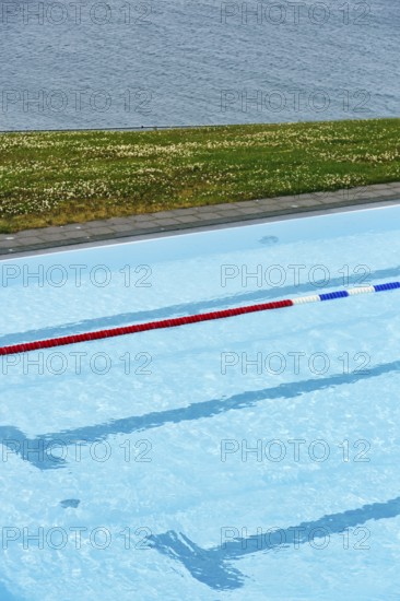 View from above of swimming pool by the sea, lane divider, lane rope in outdoor pool, Hofsos,