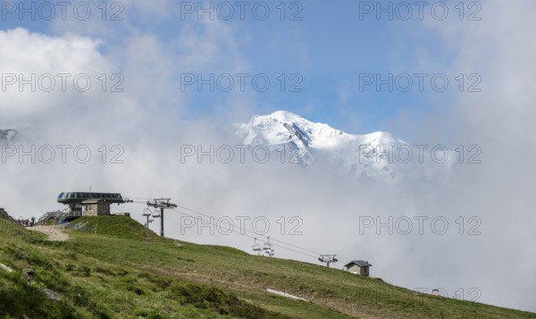 Ski lift in the Domaine de Balme ski area at Col de Balme, in summer, behind the summit of Mont