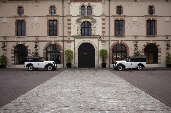 Black and white Renault Juvaquatre Editorial vintage cars in front of headquarters, head office,