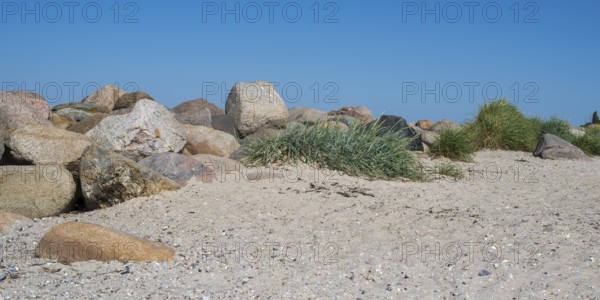 Large stones as a boundary on the sandy beach, Laboe, Baltic resort, Fjord, Baltic Sea, North