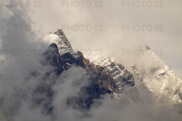 Small and large Bettelwurf with a thin layer of snow, behind wispy clouds, Small and large