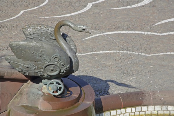 Castle fountain with swan figure by Gernot Rumpf 1984, water jet, bronze sculpture, modern art,