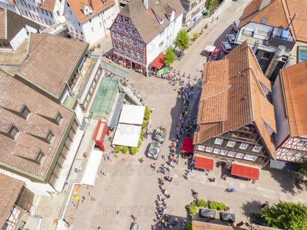 Historic buildings and crowds on a central town square, 950 years of Calw, Calw parade, Black