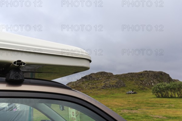Rooftop tent on car roof in volcanic landscape, detail, camping site, rain clouds, Bakkagerdi,
