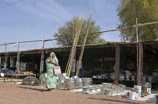Indian woman at a market stall in the Thar Desert or Great Indian Desert, near Jaisalmer,